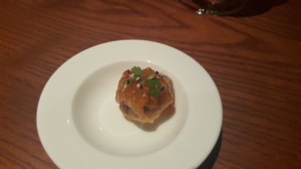 Mushroom stuffed pastry topped with an apricot sauce